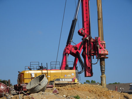 KUALA LUMPUR, MALAYSIA -MARCH 29, 2010: Bore pile rig machine at the construction site. The machine used to driven piles for building foundation work. Operated by skilled workers.のeditorial素材