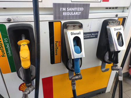 KUALA LUMPUR, MALAYSIA -MARCH 26, 2020: Fuel nozzle used to pumping petrol into a vehicle at the...