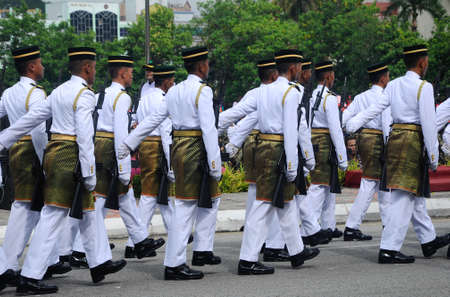 SEREMBAN, MALAYSIA -AUGUST 31, 2016: Malaysia Malay soldier with full traditional Malay uniform and weapon. Official marching for high command. Marching during Malaysia Independence Day parade 2016.のeditorial素材