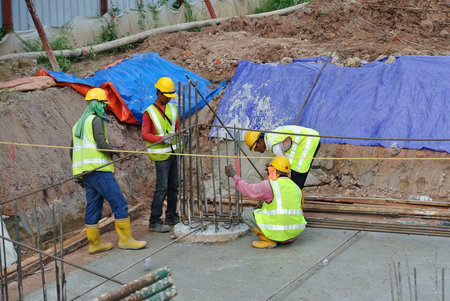 SEREMBAN, MALAYSIA -JULY 01, 2016: Construction workers working at the construction site at...