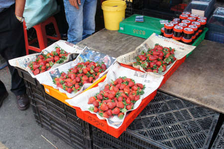 CAMERON HIGHLAND, MALAYSIA - JULY 16, 2020: Strawberries are sold in large quantities in the wholesale market. Customers will choose their own desired strawberries.のeditorial素材