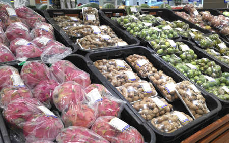 SEREMBAN, MALAYSIA -OCTOBER 09, 2017:  Fresh tropical fruit in plastic wrap and for sale. Packages is placed on the cold chiller shelf to last long.のeditorial素材