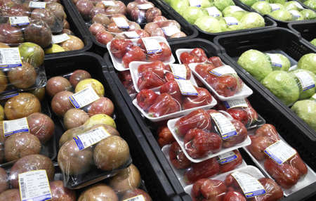 SEREMBAN, MALAYSIA -OCTOBER 09, 2017:  Fresh tropical fruit in plastic wrap and for sale. Packages is placed on the cold chiller shelf to last long.のeditorial素材