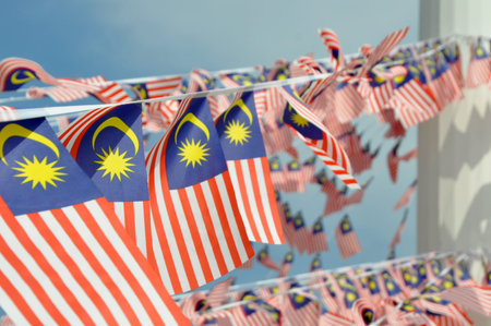 SEREMBAN, MALAYSIA -AUGUST 31, 2017: Selective focused on small size Malaysian flags tied together...