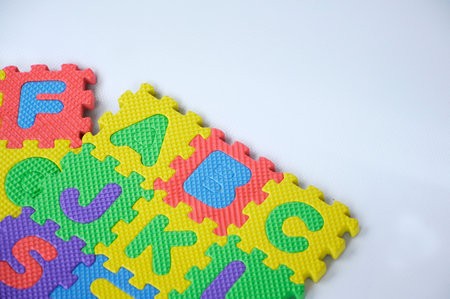 Rubber mat with colourful alphabet design isolated on white background.の写真素材