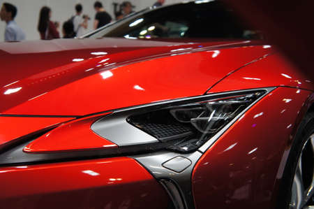 KUALA LUMPUR, MALAYSIA -NOVEMBER 23, 2018: Modern car headlight with futuristic design. Designed specifically to give enough visual for the driver at night.のeditorial素材