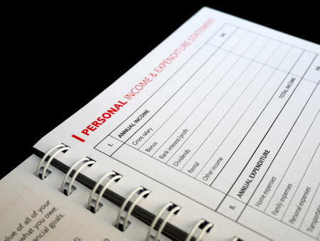 Selected focused on Personal Income and Expenditure text found on one page of a notebook. Be the title to a table of personal income entries that are still empty.の写真素材