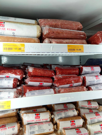 PENANG, MALAYSIA -JULY 4, 2021: Minced meat is sorted by brand and displayed in a cooling chiller....