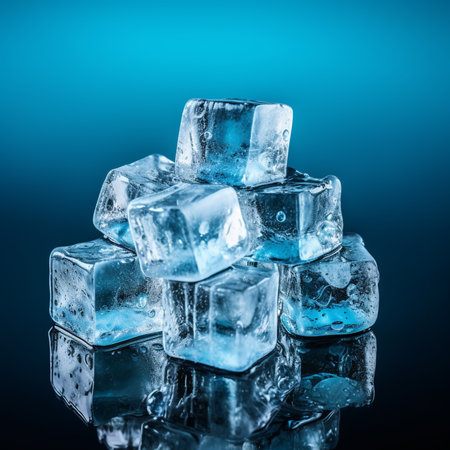 Ice cubes on blue background. Shallow depth of field. Toned.の素材