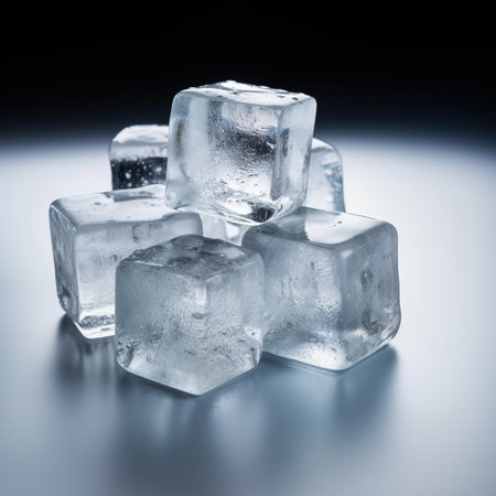 Ice cubes on a black background. Shallow depth of field. Toned.の素材