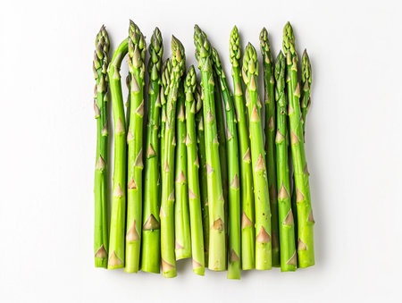 Bunch of fresh green asparagus on white background, top viewの素材