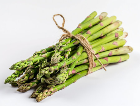 Bunch of fresh green asparagus isolated on white background.の素材