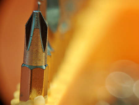 Close up of screwdriver bit captured by macro lens with bokeh background.の写真素材
