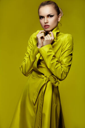 Fashion shot of a woman in pink coat の写真素材