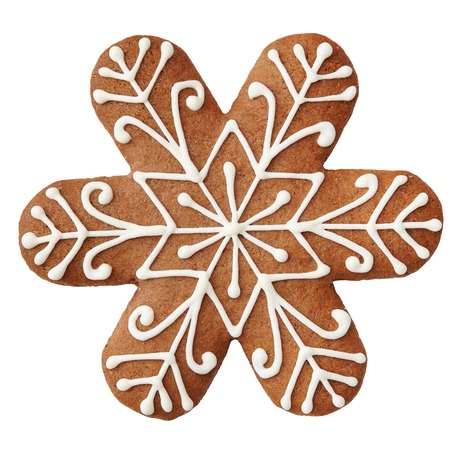 Gingerbread cookie in snowflake shape isolated on white background.の写真素材