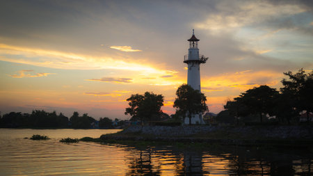 Sunset over the river in the evening summer time.の写真素材