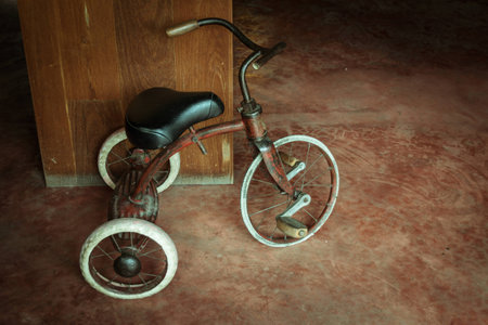 old tricycle againstの写真素材