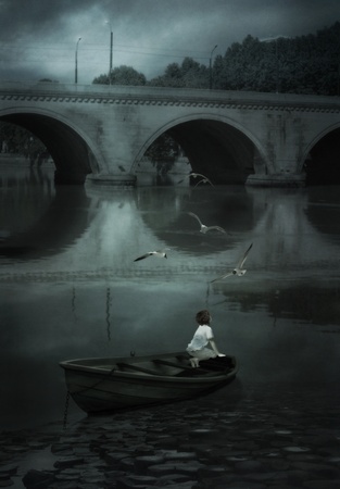 Before dawn, a boy admires seagullsの写真素材