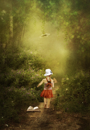  A little girl goes to the magical land of fairy talesの写真素材