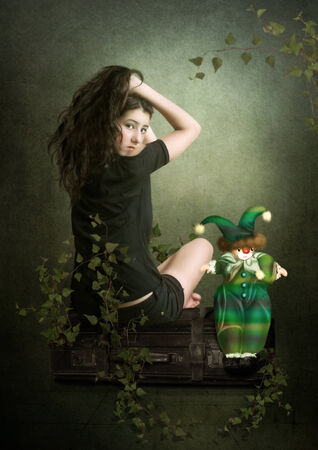 Girl and clown dollの写真素材