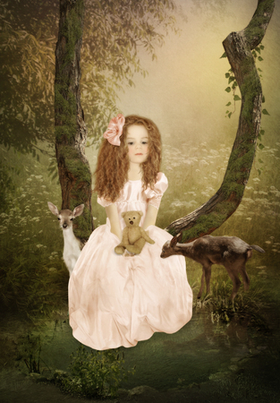 Sad little girl with long hair with teddy bear and Fawnsの写真素材