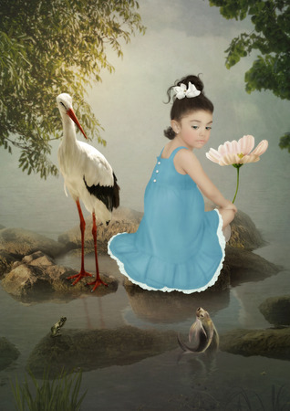 Little girl, crane and fishの写真素材