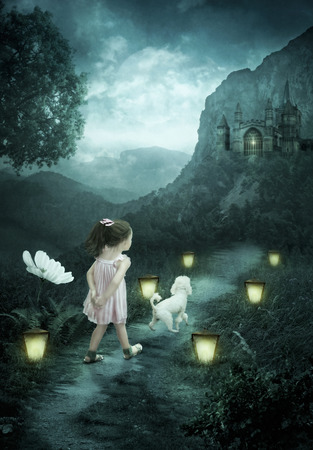 Little girl and poodle.The road to the magic castleの写真素材