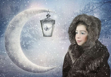Little girl in a sheepskin coat in the winter forest looking at a moth in a lantern. Winter fairy tale.の写真素材