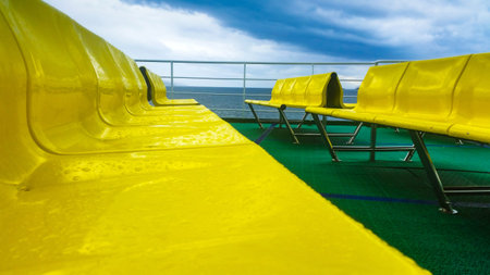 Empty yellow seats on the ferry