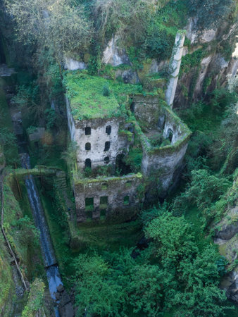 View of the ancient idyllic ruin of a mill in the valleyの写真素材
