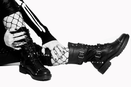 women's legs in black boots
