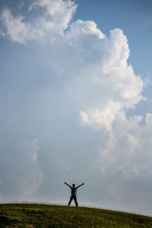 Happy expressions against a landscape.の写真素材