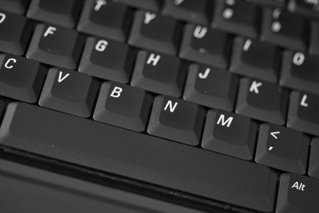 Closeup of computer keyboard keys showing details.