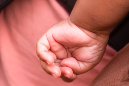 A closeup of baby palm & fingers.の写真素材
