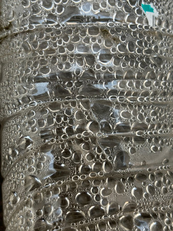 Closeup of drops of water on coolers and plastic water bottles.の写真素材