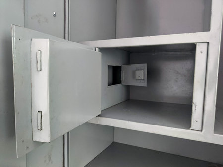 Metal cupboard open locker door steel almirah closeup greyの写真素材