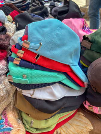 Close-up of a stack of baseball caps on display storeの写真素材