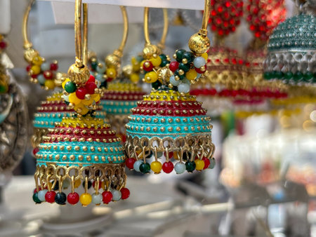 Indian woman ear ring jewellery displayed in street shop closeupの写真素材