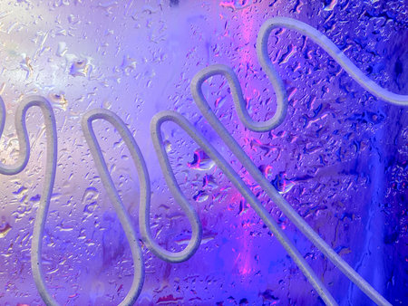 Abstract background with wavy lines and water droplets on a blue and purple surface.