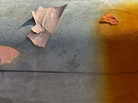 Abstract background with peeling paint on a rusty metal surface, showcasing textures and color...