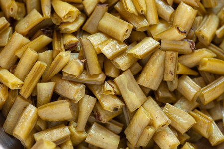 Close-up of chopped boiled cluster beans, fresh organic produce background.の写真素材