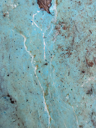 A blue and brown surface with a white line. The blue is the dominant color. The white line is the...
