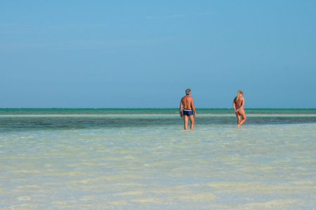 couple walking by the ocean