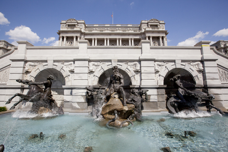 WASHINGTON D.C. - MAY 23, 1014: The Court of Neptune Fountain is a group of bronze sculptures, by Roland Hinton Perry in 1897-1898. They are located at the Library of Congress , in Washington, D.C.  The god Neptune is flanked by figures of the Tritons, eaのeditorial素材