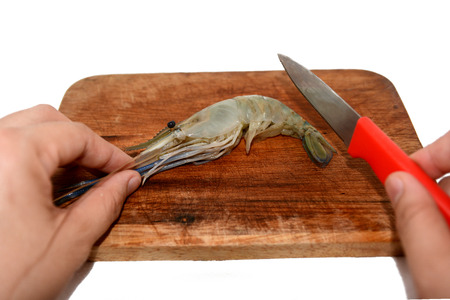 a raw shrimp on cutting boardの写真素材