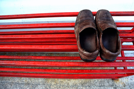 old leather shoes on the shoe rackの写真素材