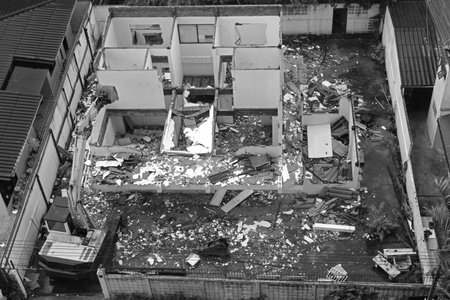 Top view of damage area, crash and collapse building with excavator to manage area,under...