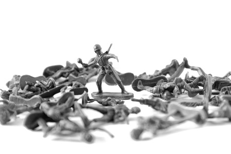 small green soldier model action shooting gun with other soldier model onthe floor, white backgroundの写真素材