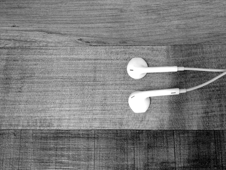 White earphone on the floorの写真素材