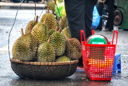 Lots of Durian in the basket of market women hawker with other utility basketの写真素材